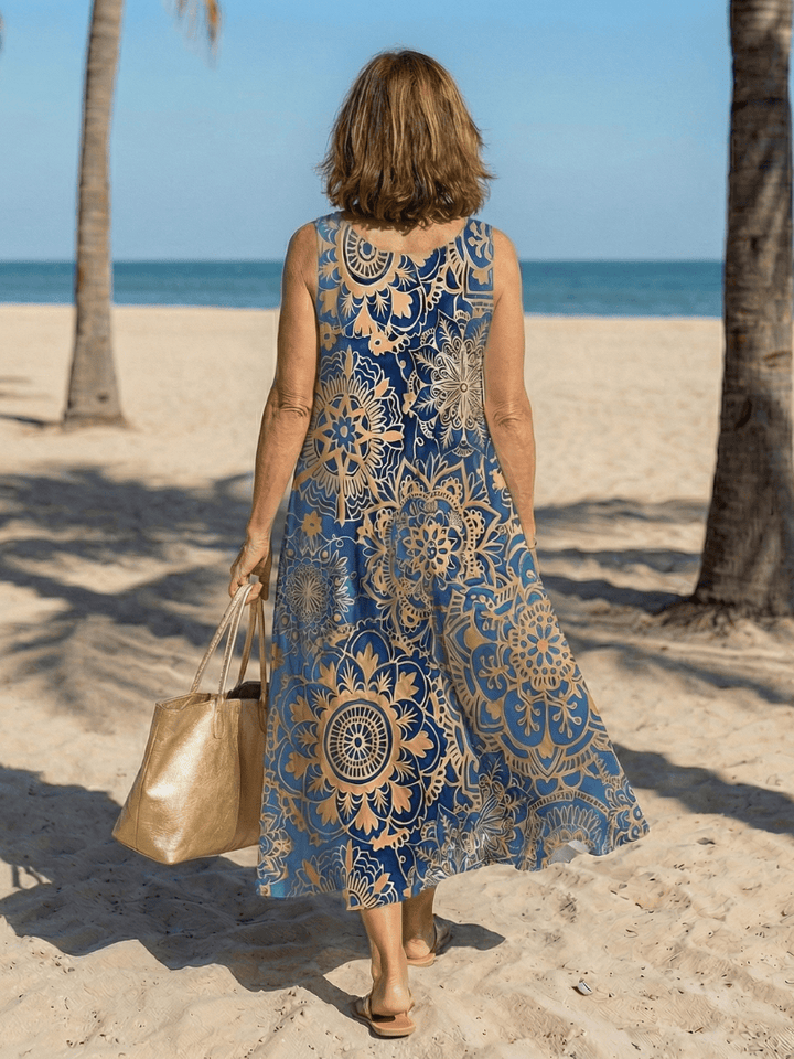 Neraya™ Open Air Midi Dress by Emma & Rose Cape Town, featuring flowy fabric and elegant design, displayed on a mannequin.