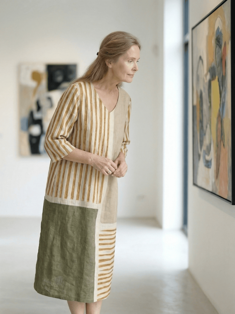 Emma & Rose Cape Town Soren™ mixed stripe midi dress with a flowing silhouette and stylish pattern in a close-up view.