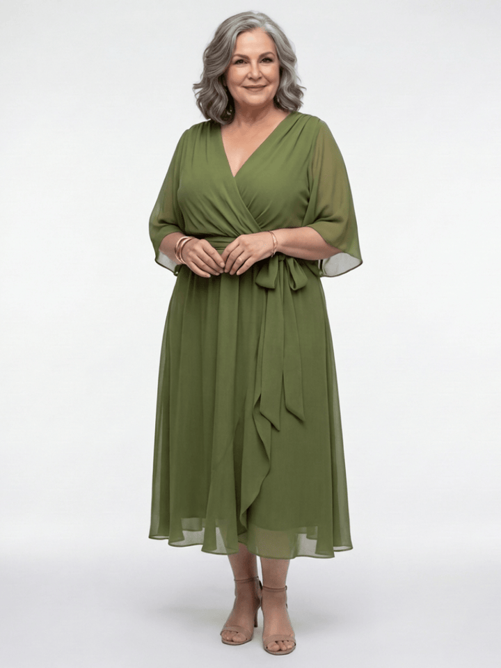 Elysia™ waist tie midi dress by Emma & Rose Cape Town featuring a flowy fabric and elegant waist tie detail.