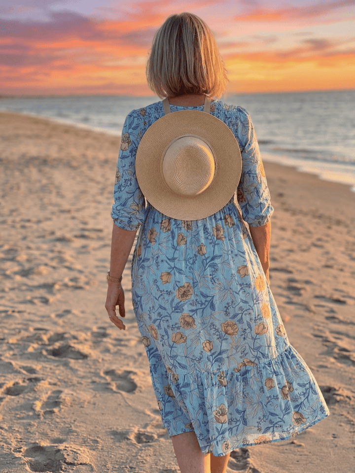 Halia Meadow Gather Midi Dress by Emma & Rose Cape Town featuring floral print, lightweight fabric, and a flowing, feminine silhouette.