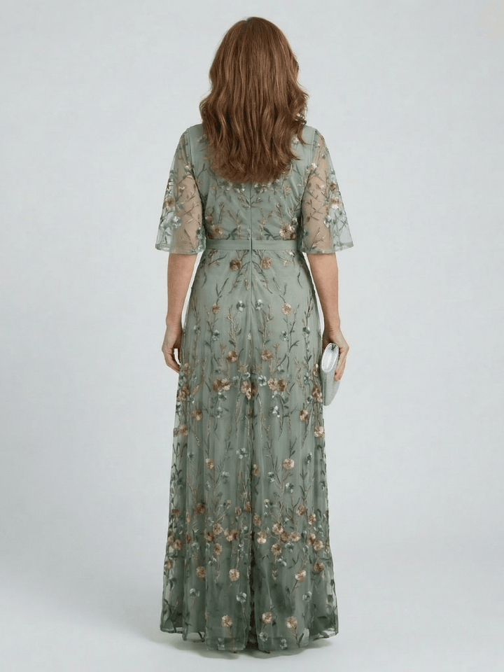 Selora™ Bloom Flow Maxi Dress by Emma & Rose Cape Town featuring floral pattern and flowing fabric, full-length view.
