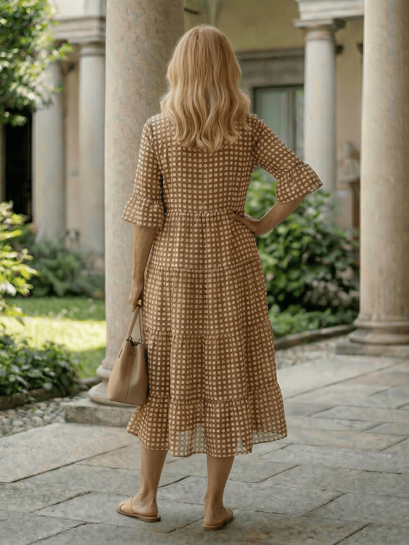 Emma & Rose Cape Town Arlo™ Dot Tiered Midi Dress featuring a playful dot pattern and flowing tiered silhouette.