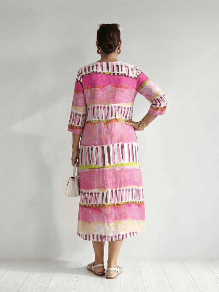 Emma & Rose Cape Town Calla™ Easy Flow Patterned Dress with flowing fabric and floral print, displayed on a hanger.