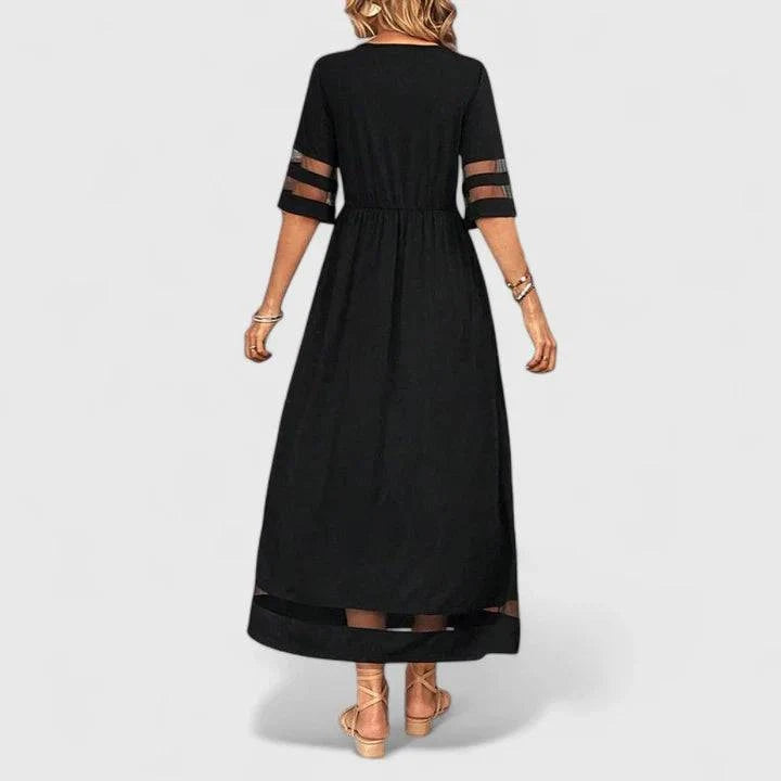 Elegant Delymarina™ midi dress by Emma & Rose Cape Town, featuring a flowing fabric and stylish design, displayed on a hanger.