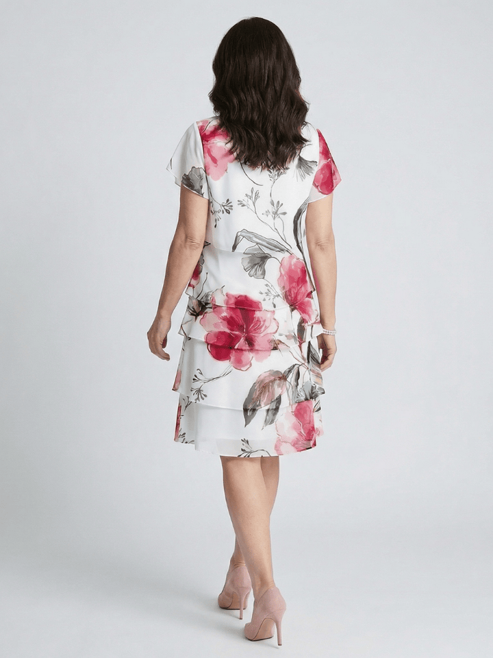 Keoni™ layered knee-length dress by Emma & Rose Cape Town, featuring a stylish, flowing design perfect for casual or dressy occasions.
