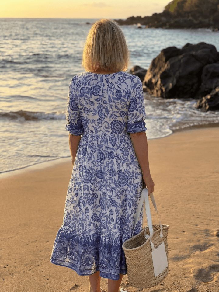 Nalani™ porcelain midi dress by Emma & Rose Cape Town, featuring a flowing fabric and elegant design on a model.