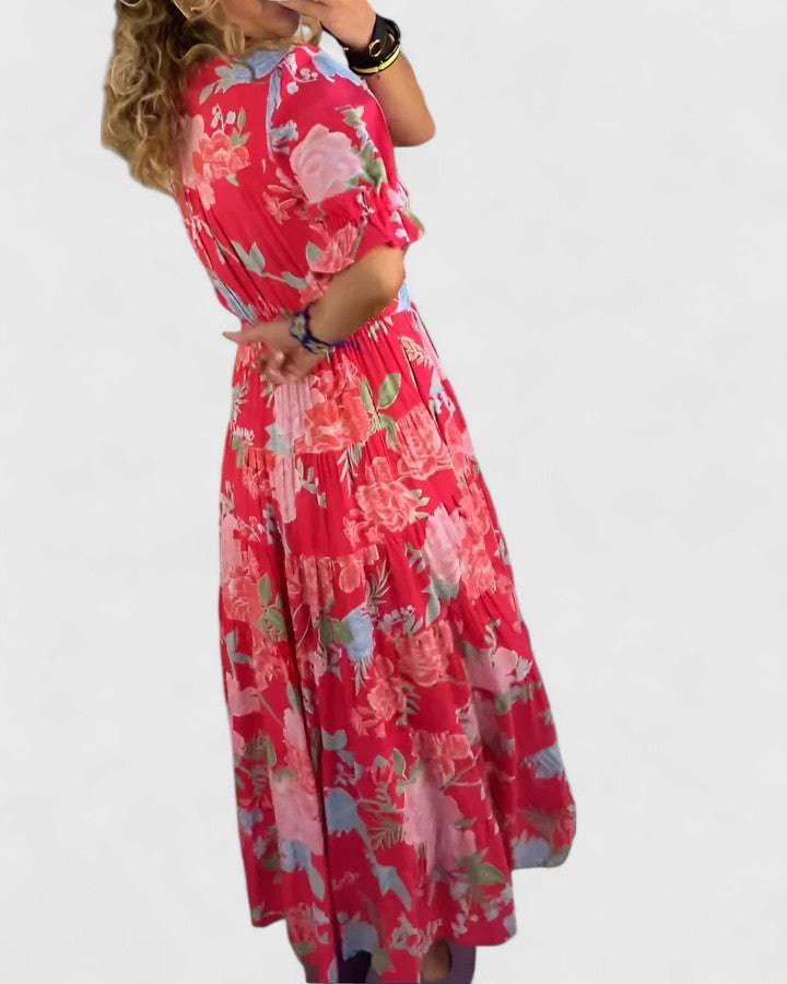 Emma & Rose Cape Town Minelda™ floral V-neck dress with elegant design, featuring a fitted bodice and flowing skirt.
