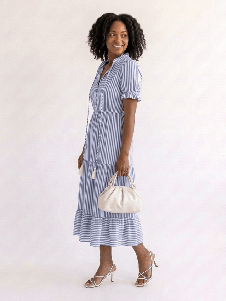 Emma & Rose Cape Town Dakota™ striped tiered midi dress with ruffled layers and adjustable straps, shown on a model.
