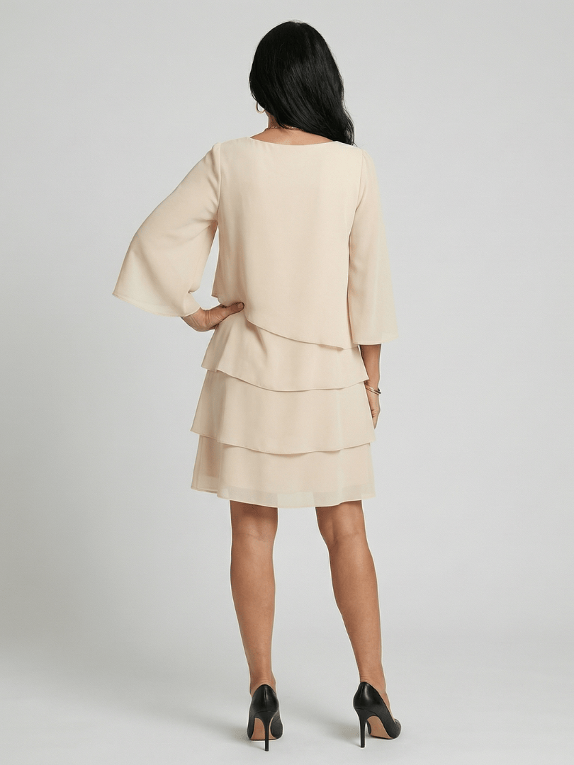 Della™ Sleeve Knee Length Dress by Emma & Rose Cape Town, featuring a stylish knee-length design with long sleeves.