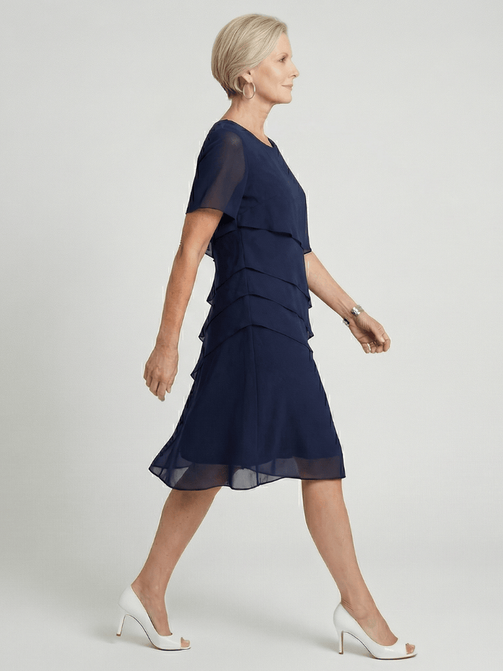 Orson™ contour knee-length dress by Emma & Rose Cape Town, featuring a fitted silhouette and elegant design.