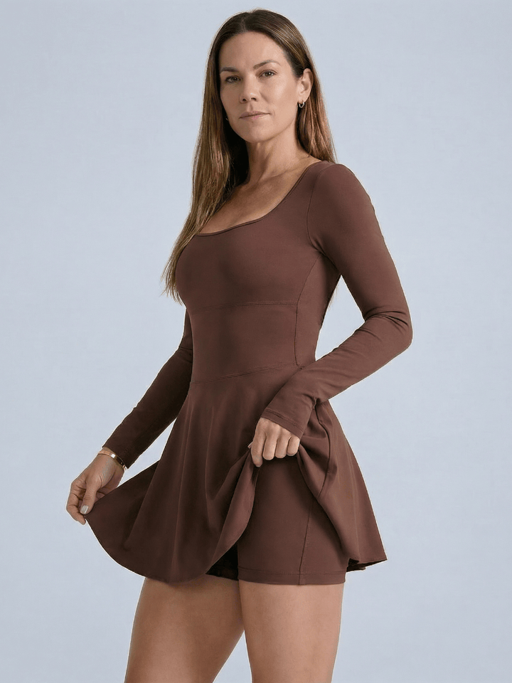 Emma & Rose Cape Town Blaire™ Core Skirt Tennis Dress shown on a model, featuring a fitted tennis dress with a skirt and athletic design.
