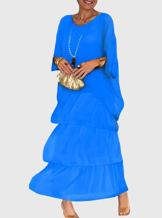 Susan™ long flowing elegant dress by Emma & Rose Cape Town, shown in a full-length view with soft fabric and intricate details.