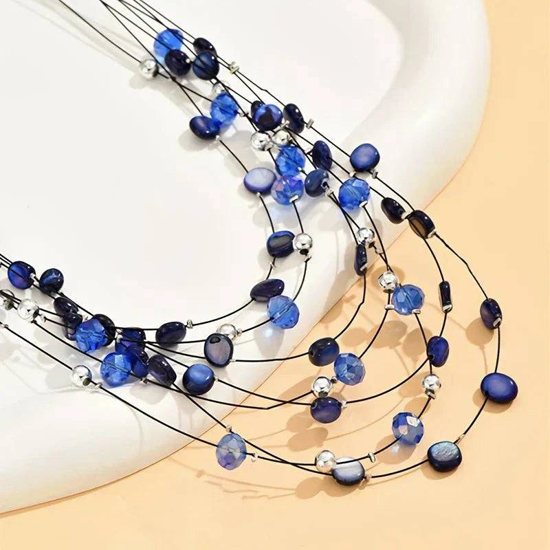Norheen™ Bohemian Pearl Necklace featuring layered white pearls and gold accents, stylish jewelry from Emma & Rose Cape Town