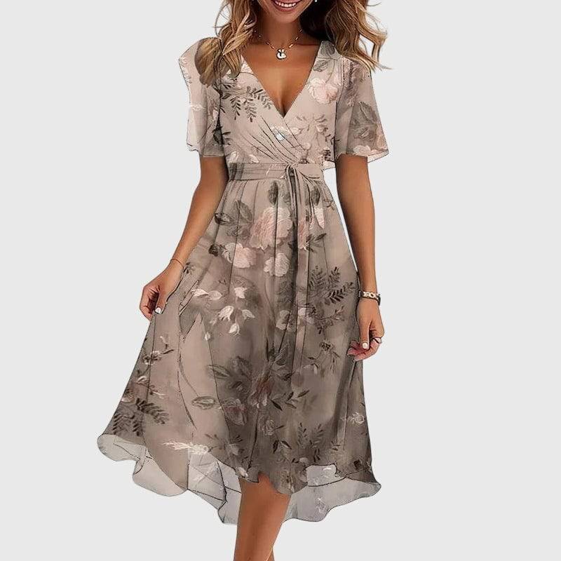 Emma & Rose Cape Town Catalina™ chic midi dress with floral pattern and elegant neckline, displayed on a hanger against a neutral background.