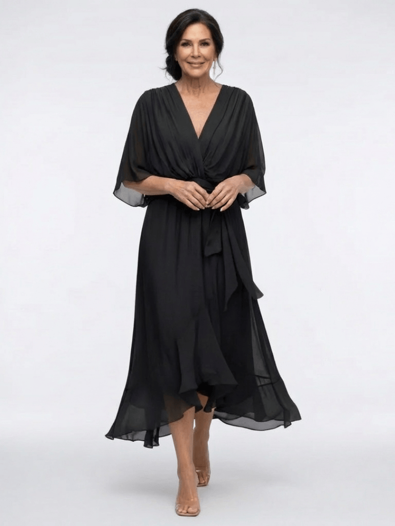 Elysia™ waist tie midi dress by Emma & Rose Cape Town, featuring a flowy fabric and waist tie detail, shown on a model.