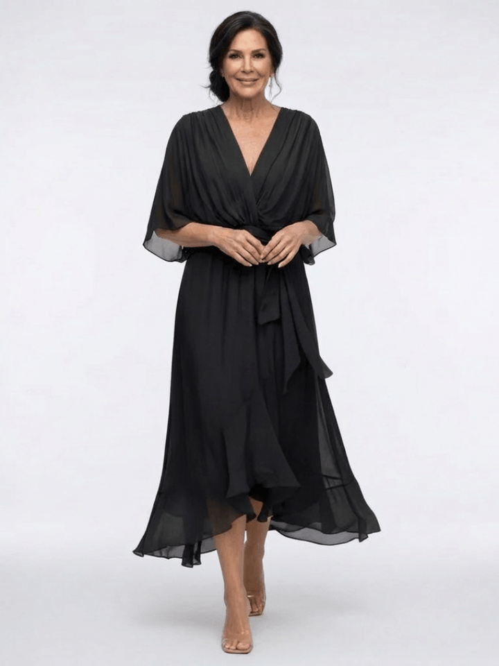 Elysia™ waist tie midi dress by Emma & Rose Cape Town, featuring a flowy fabric and waist tie detail, shown on a model.