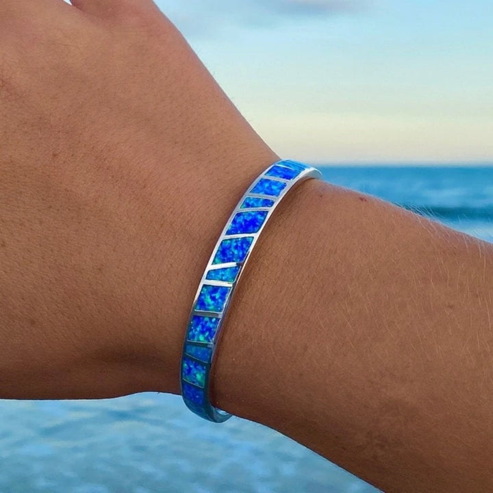 Silver bracelet with blue opal and refined details