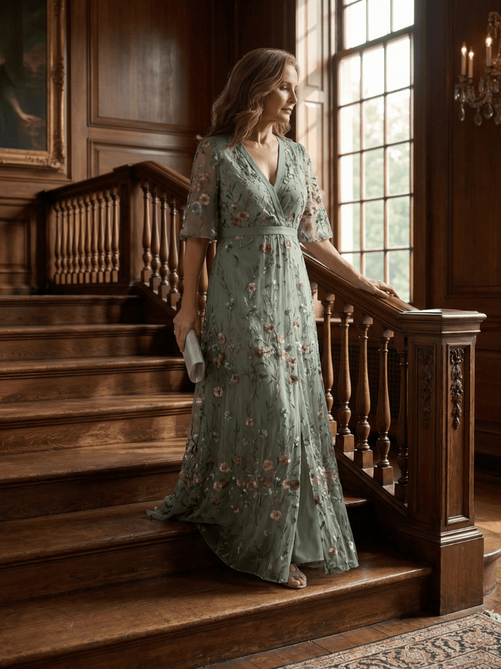 Selora Bloom Flow Maxi Dress by Emma & Rose Cape Town, featuring a floral pattern and flowing fabric, displayed on a hanger.