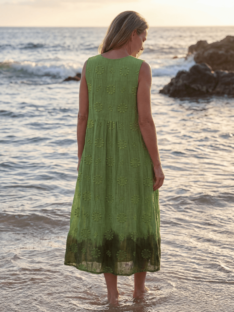 Kapua™ Garden Texture Midi Dress by Emma & Rose Cape Town, shown with floral pattern, flowing fabric, and midi length.