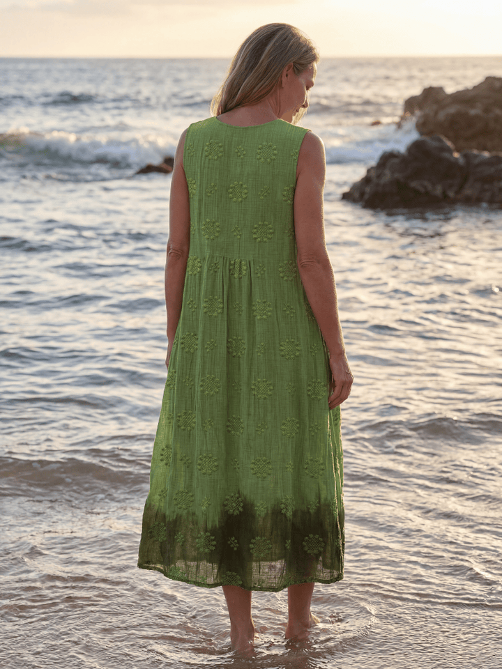 Kapua™ Garden Texture Midi Dress by Emma & Rose Cape Town, shown with floral pattern, flowing fabric, and midi length.