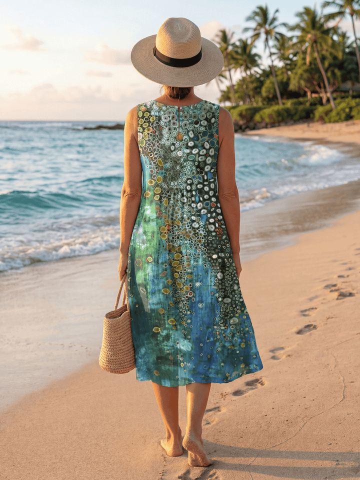 Moana Ocean Mosaic Midi Dress by Emma & Rose Cape Town displayed with vibrant, colorful ocean-inspired pattern and flowing fabric.