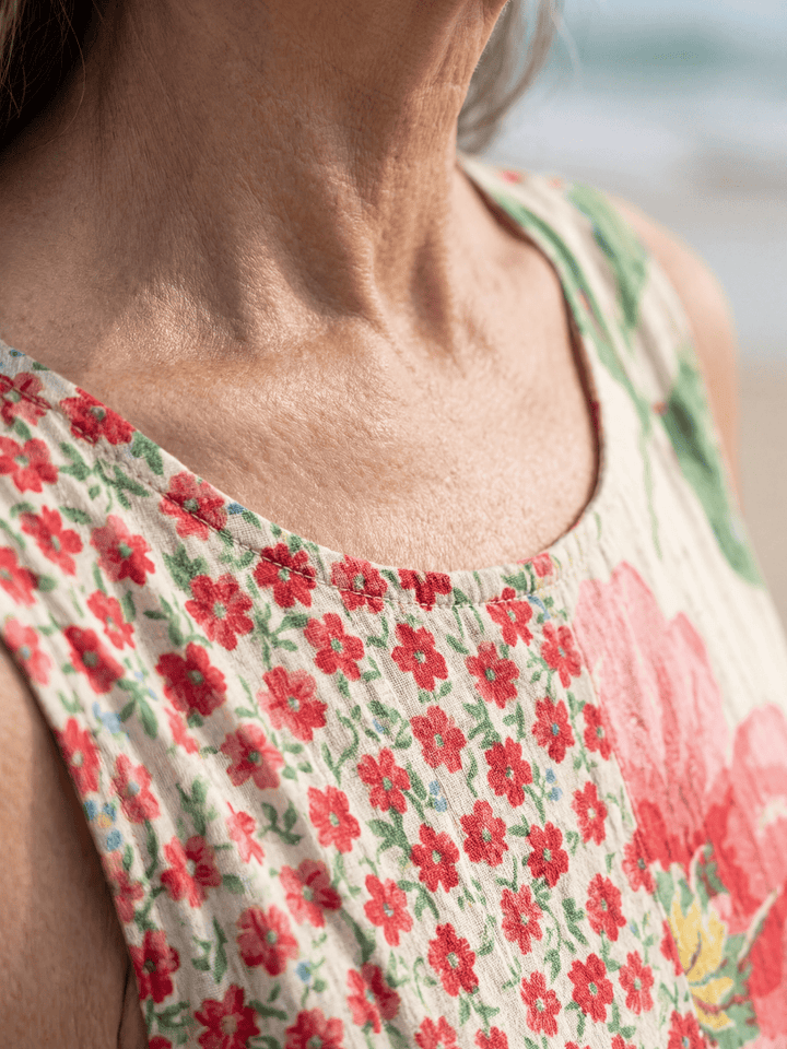 Kira™ Coastal Floral Midi Dress by Emma & Rose Cape Town featuring a flowing fabric and vibrant floral pattern.