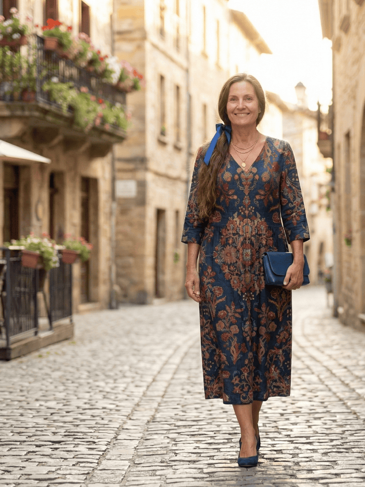 Ivy™ Soft Form Midi Dress by Emma & Rose Cape Town displayed in a neutral color with a fitted bodice and flowing skirt.