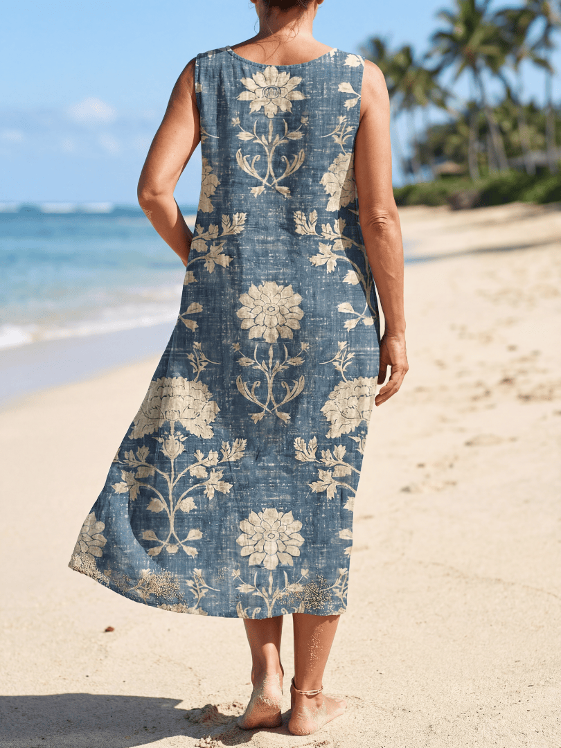 Kailo™ Shoreline Floral Midi Dress by Emma & Rose Cape Town featuring a lightweight, flowy fabric with a floral pattern.
