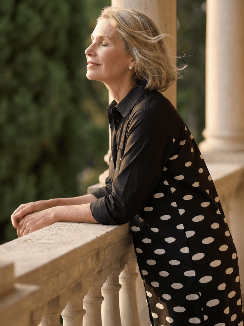 Faye™ Evening Walk Dress by Emma & Rose Cape Town, stylish black dress with elegant silhouette and floral details.