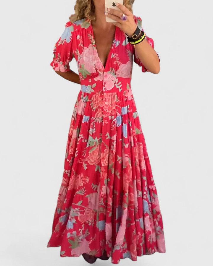 Elegant floral V-neck dress by Emma & Rose Cape Town, featuring a stylish design with colorful floral patterns.