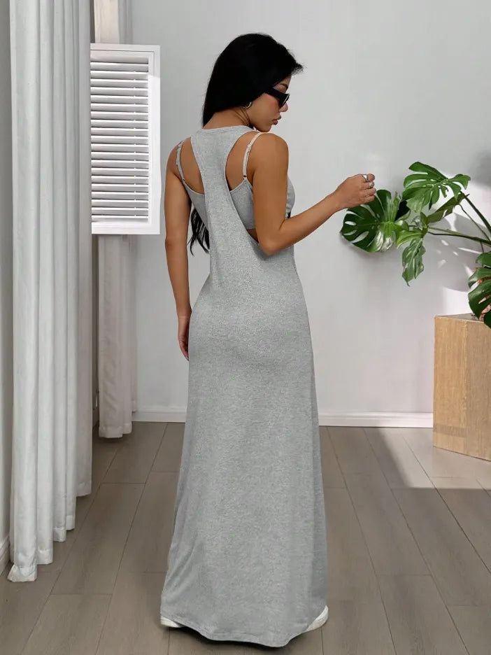 Long women's dress with a two-piece effect and side cutouts