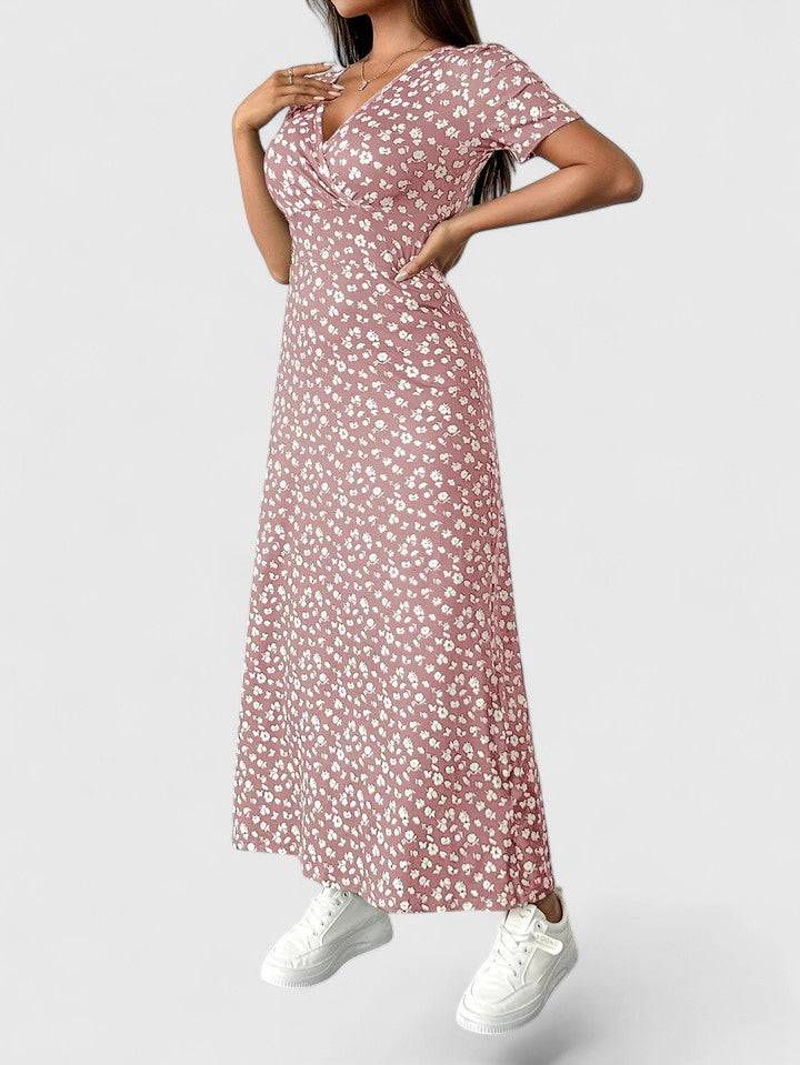 Emma & Rose Cape Town Yulivette™ sophisticated maxi dress with elegant flowing fabric and stylish design, worn by a model outdoors.