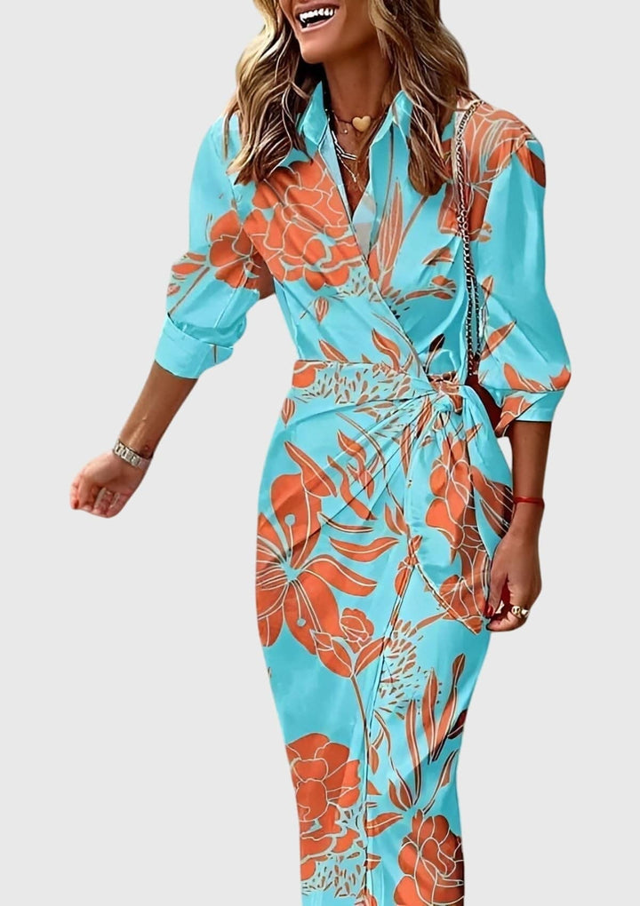 Everly™ elegant wrap dress with floral print by Emma & Rose Cape Town, shown in a stylish, flowing fabric design.