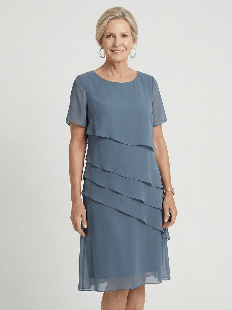 Orson™ contour knee-length dress by Emma & Rose Cape Town, featuring a fitted silhouette and stylish design, shown on a model.
