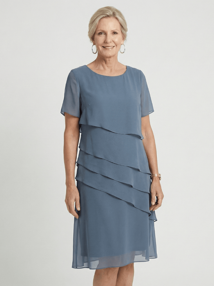 Orson™ contour knee-length dress by Emma & Rose Cape Town, featuring a fitted silhouette and stylish design, shown on a model.