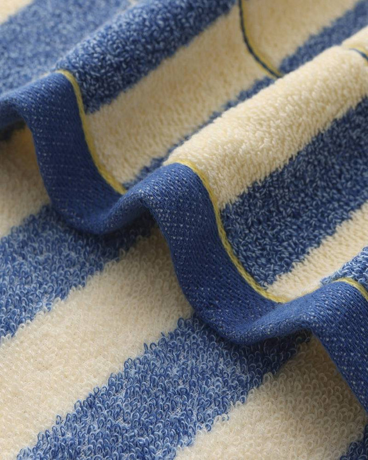Emma & Rose Manhattan Lance™ Sea Stripe Hand Towel featuring ocean-inspired blue and white stripes with soft, absorbent fabric.