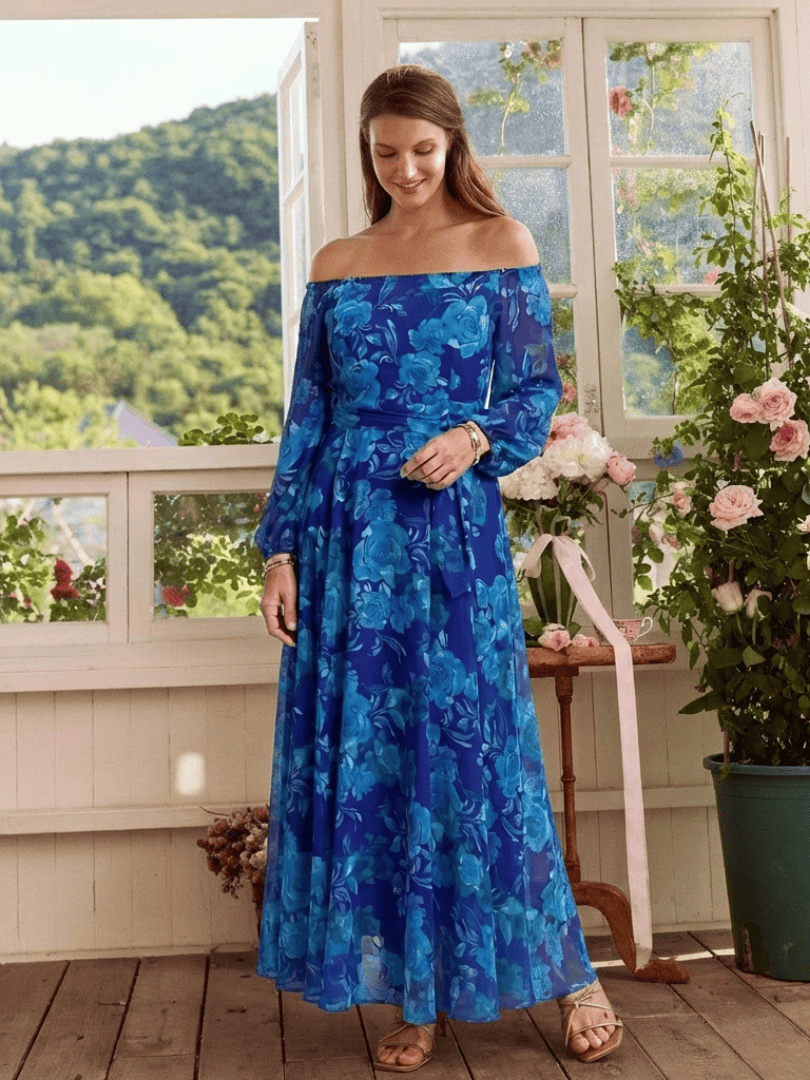 Aspen™ shoulder floral maxi dress by Emma & Rose Cape Town featuring a flowing fabric and vibrant floral pattern.