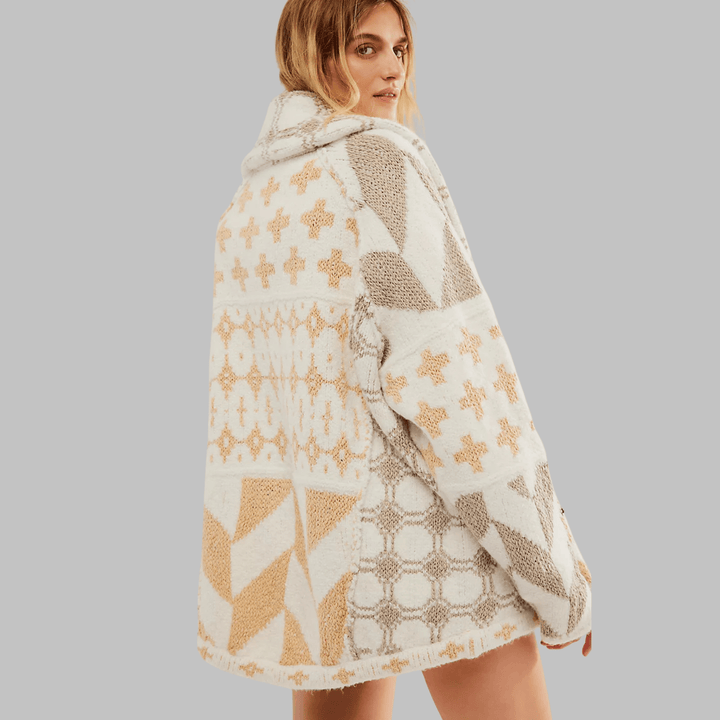 Emma & Rose Cape Town Portia™ long sleeve oversized cardigan in soft knit fabric, draped on a hanger.
