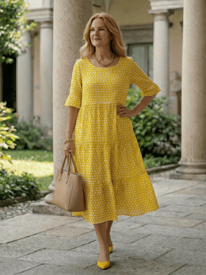 Emma & Rose Cape Town Arlo™ Dot Tiered Midi Dress featuring a flowy, layered design and playful dot pattern.