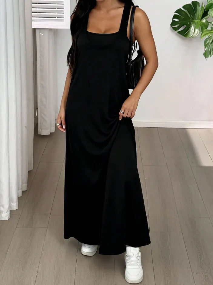 Long women's dress with a two-piece effect and side cutouts