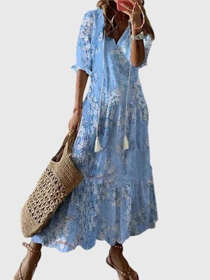 Emma & Rose Cape Town Amalia™ boho vintage summer dress with floral patterns and flowing fabric, ideal for warm weather.
