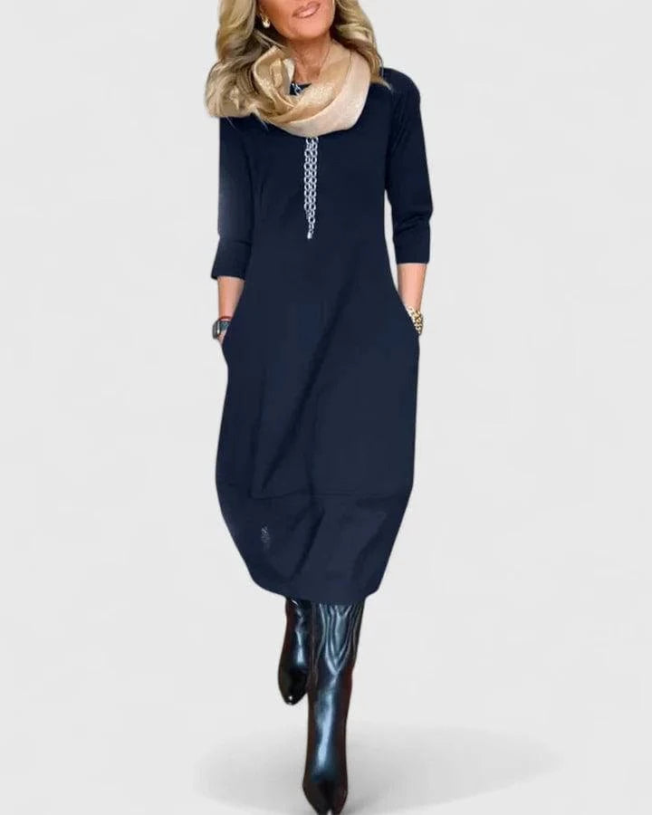 Elegant Danyshka™ midi dress by Emma & Rose Cape Town, shown in a sophisticated silhouette with flowing fabric.