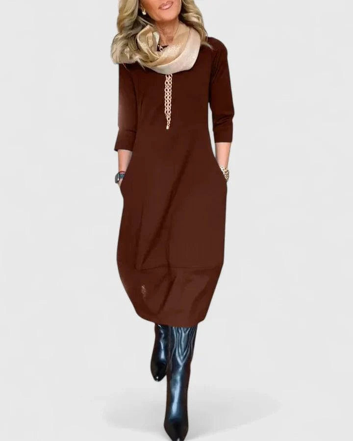 Elegant Danyshka™ midi dress by Emma & Rose Cape Town displayed in a stylish silhouette with flowing fabric and sophisticated design.