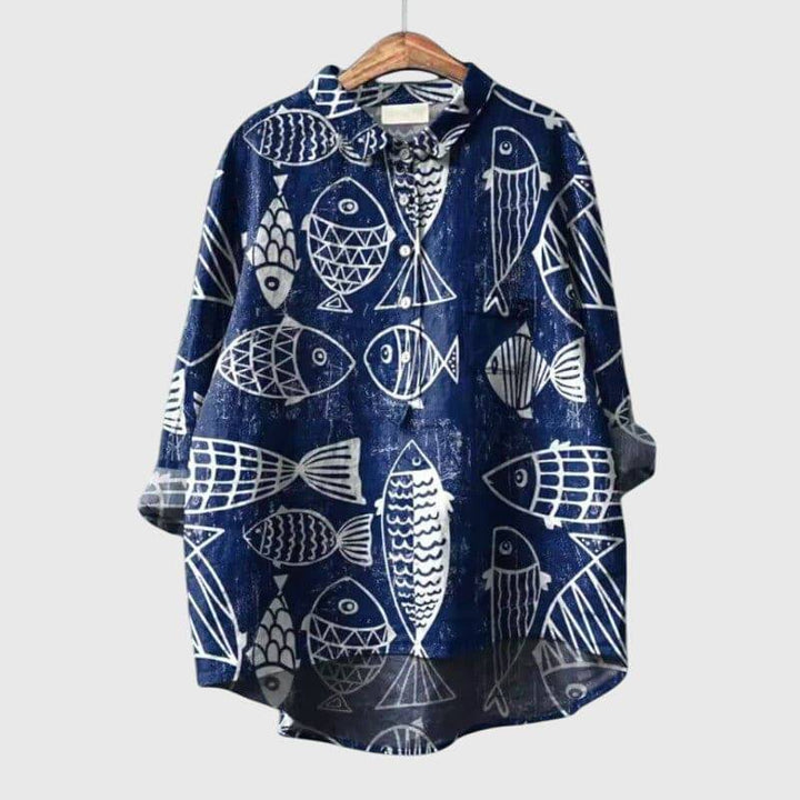 Elegant Lumi™ blouse by Emma & Rose Cape Town, featuring a stylish, flowing design with intricate detailing and a sophisticated fit.