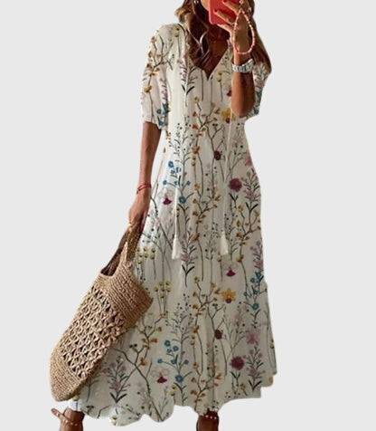 Emma & Rose Cape Town Amalia™ boho vintage summer dress with floral pattern and flowing fabric, perfect for warm weather.