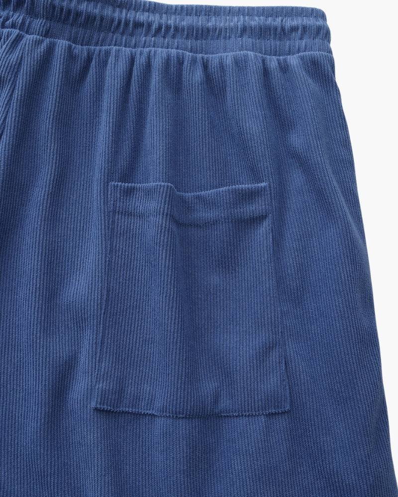 Emma & Rose Manhattan Dean™ Beachstride Shorts in light fabric with a relaxed fit and adjustable waistband, displayed on a hanger.