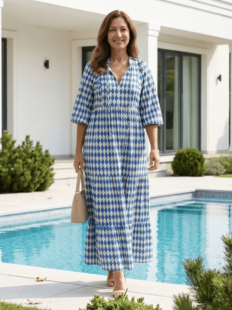 Elodie™ Print Tiered Midi Dress by Emma & Rose Cape Town, featuring a flowing tiered design and vibrant floral print.