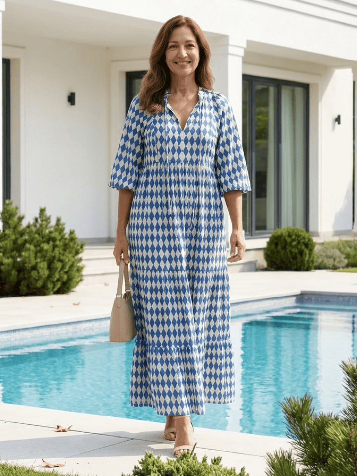 Elodie™ Print Tiered Midi Dress by Emma & Rose Cape Town, featuring a flowing tiered design and vibrant floral print.
