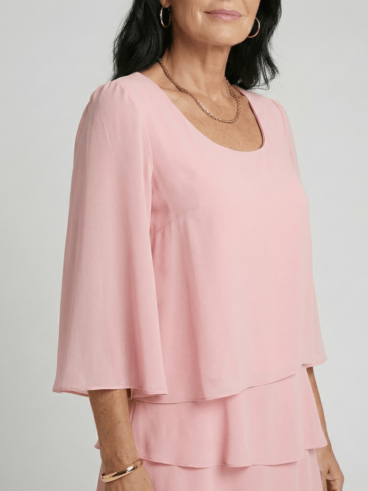 Della™ knee-length sleeve dress by Emma & Rose Cape Town, in a stylish, elegant design with a fitted silhouette and classic neckline.