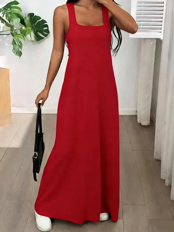 Long women's dress with a two-piece effect and side cutouts
